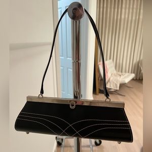 Black rectangular Handbag with top stitch detail design on front and handle.